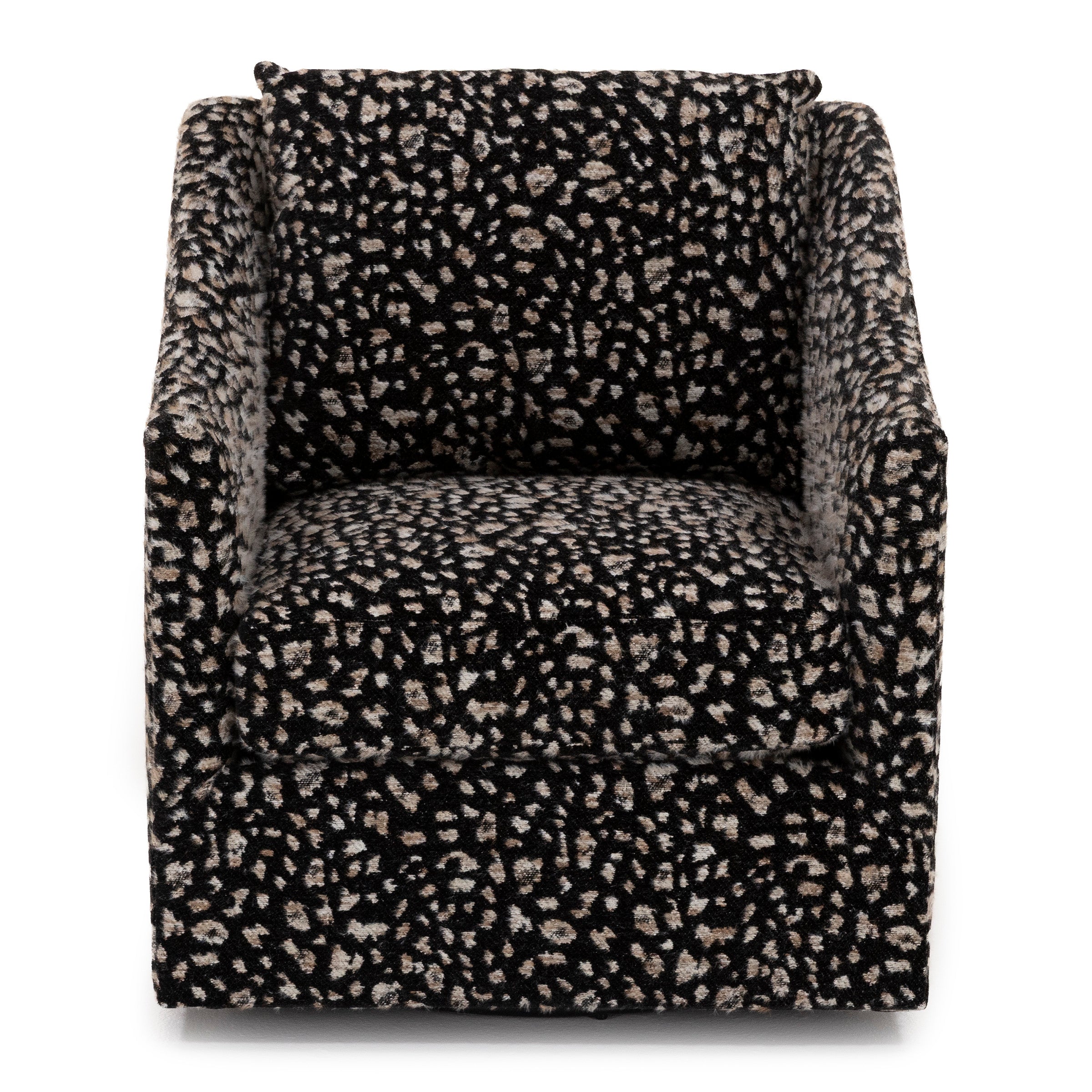 Front view of a modern armchair with a black and beige abstract patterned fabric.
