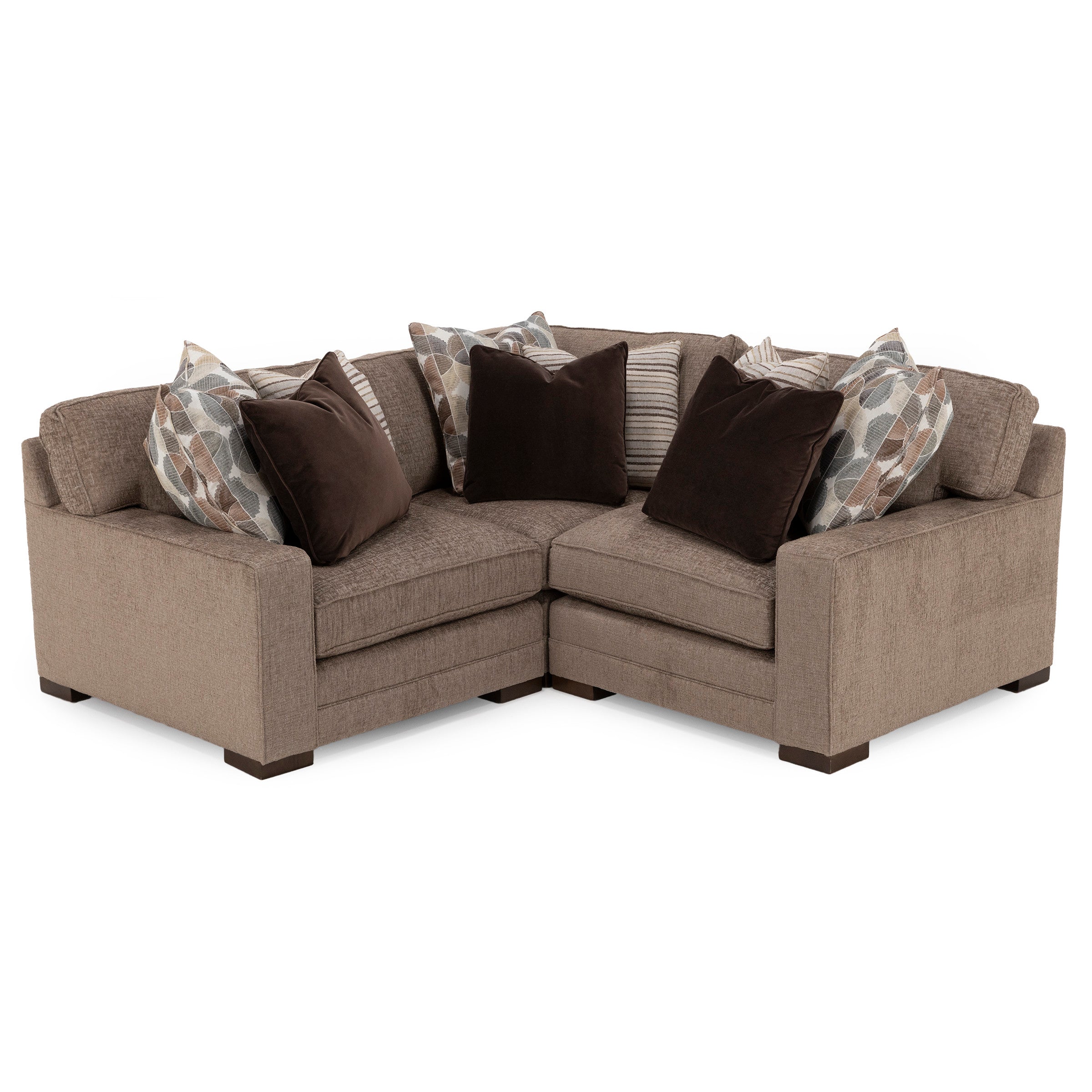 Brown fabric sectional sofa with assorted patterned and solid pillows.