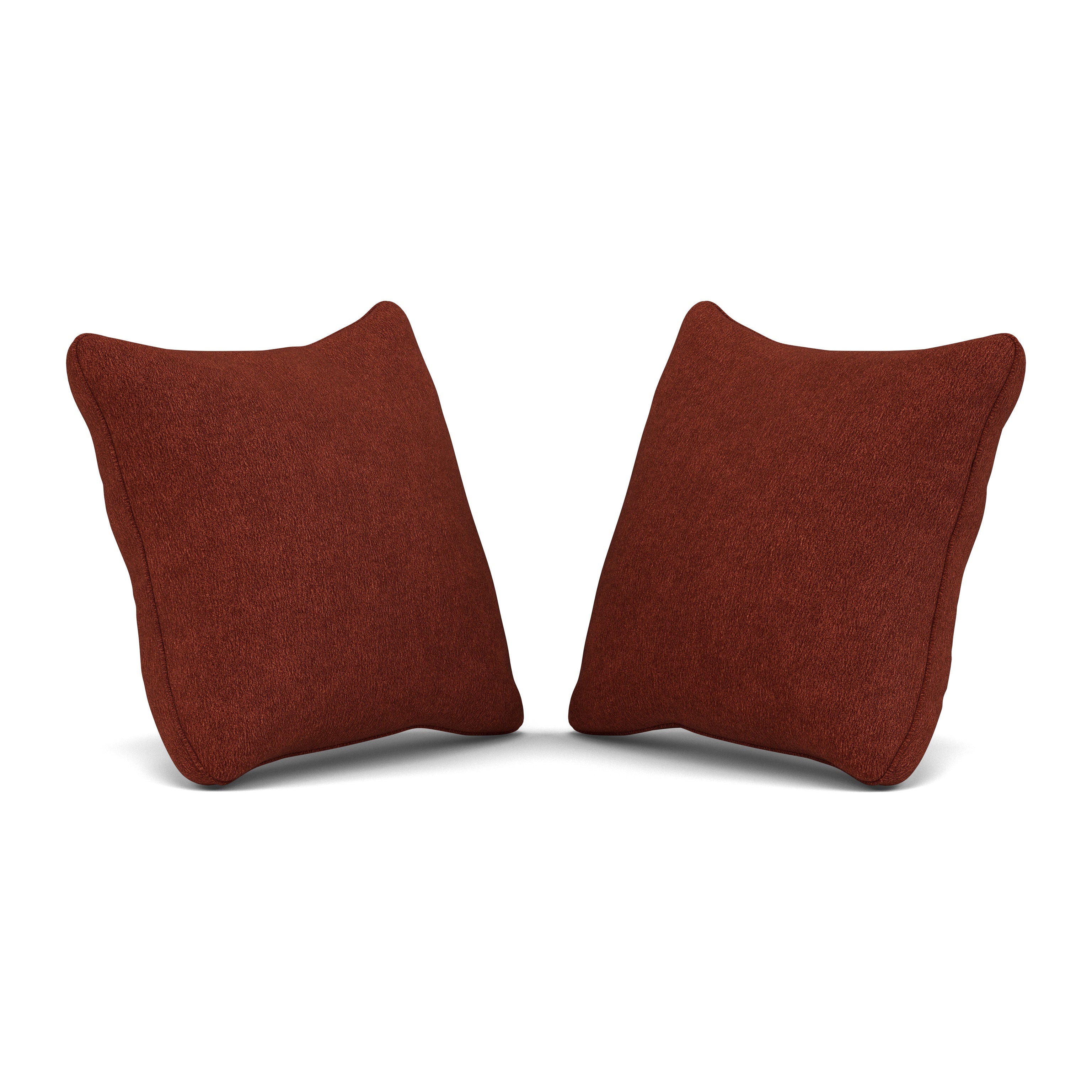 Two rust-colored square throw pillows on a white background.