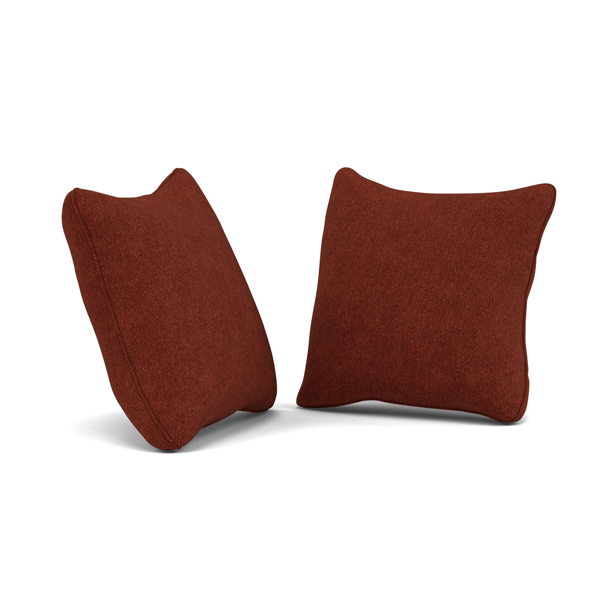 Two square rust-colored throw pillows on a white background.