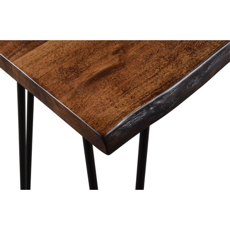 Close-up of a wooden tabletop with a natural edge and black metal legs.