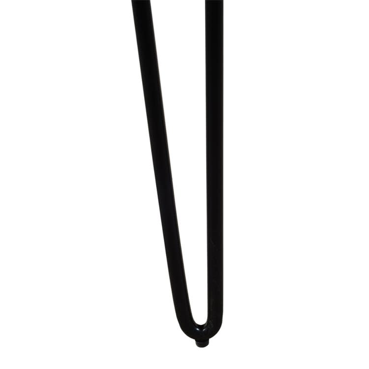 Close-up of a black metal hairpin table leg against a white background.