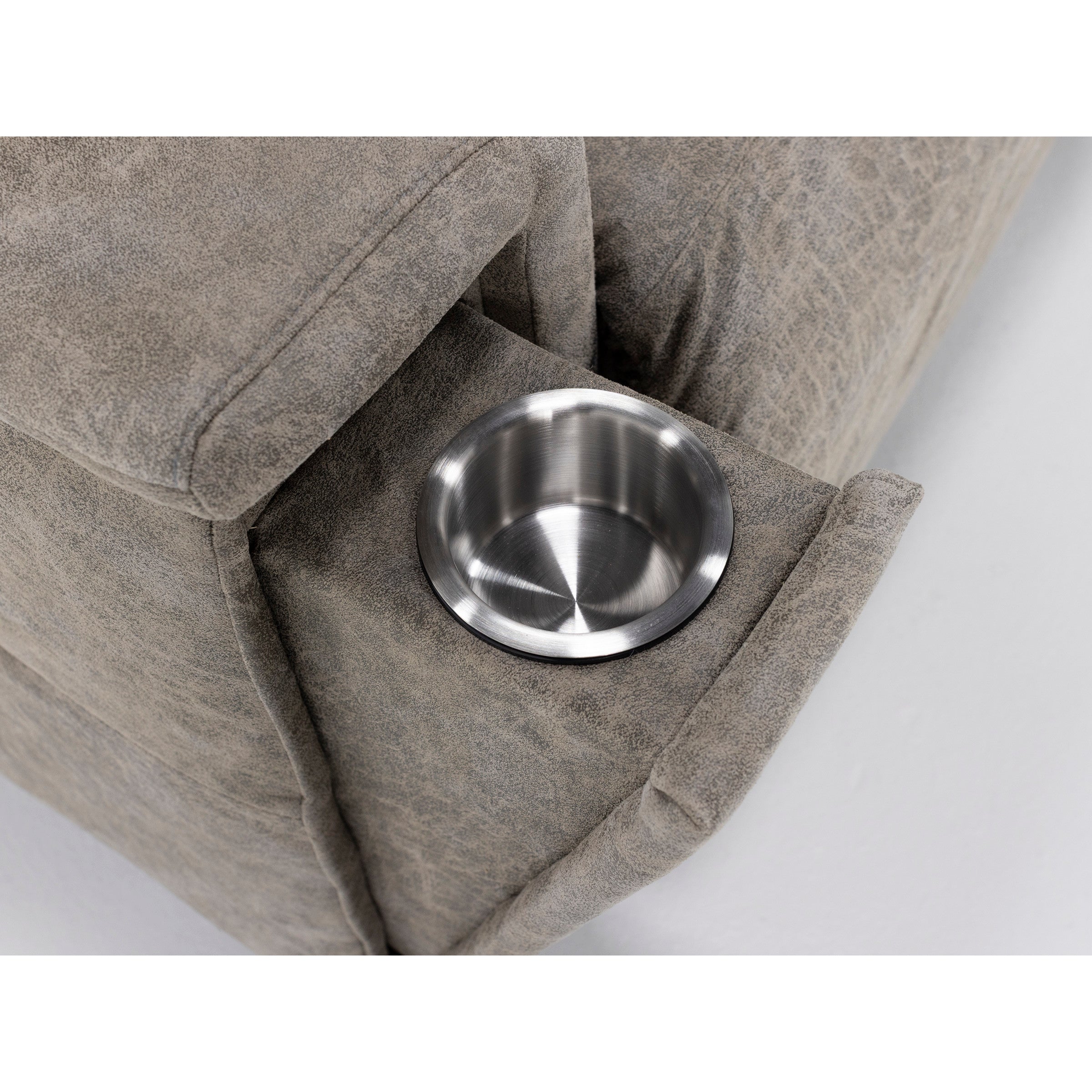 Close-up of a sofa armrest with a built-in stainless steel cup holder.