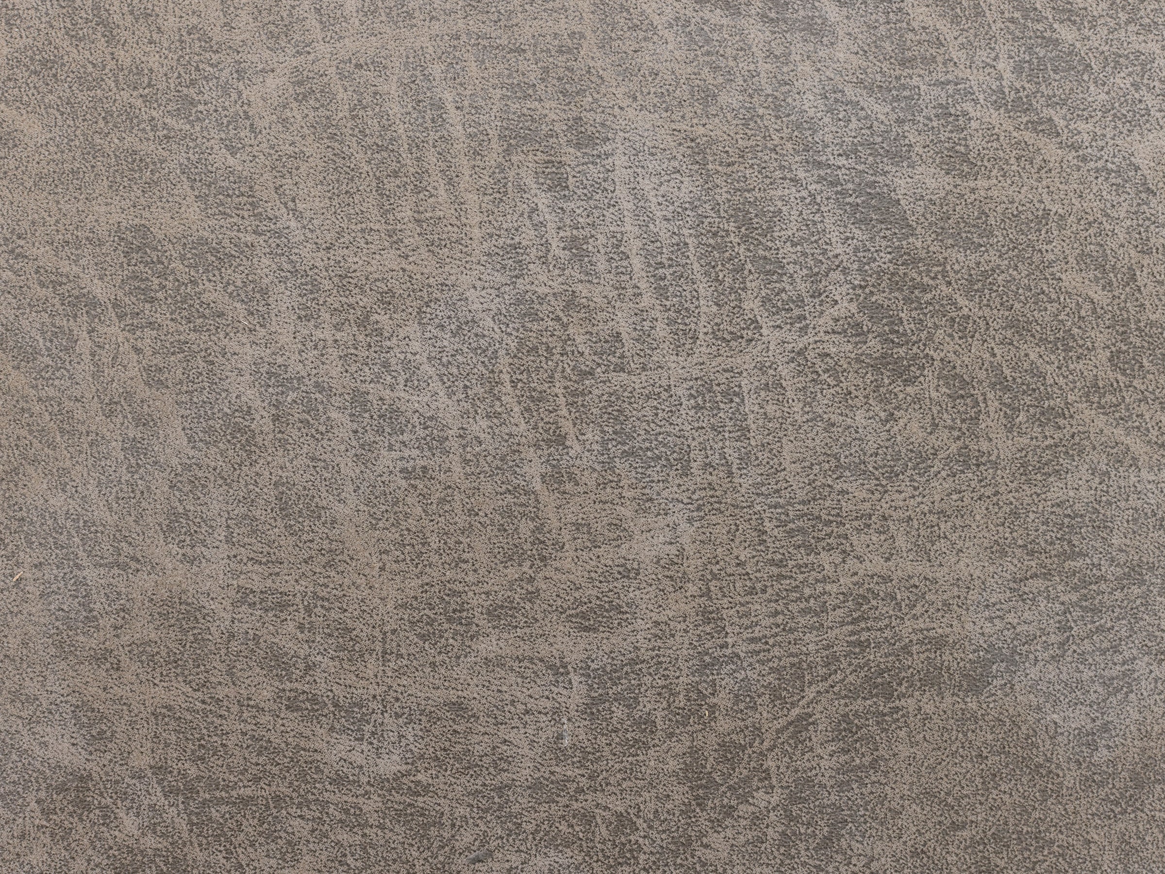 Distressed brown leather texture with visible creases and lines.