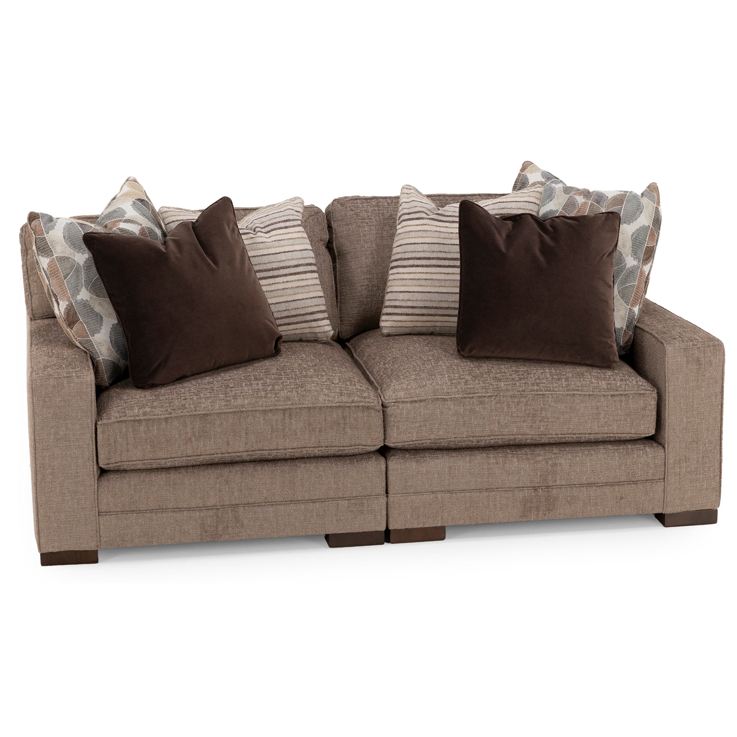 Beige upholstered sofa with mix of patterned and solid throw pillows.