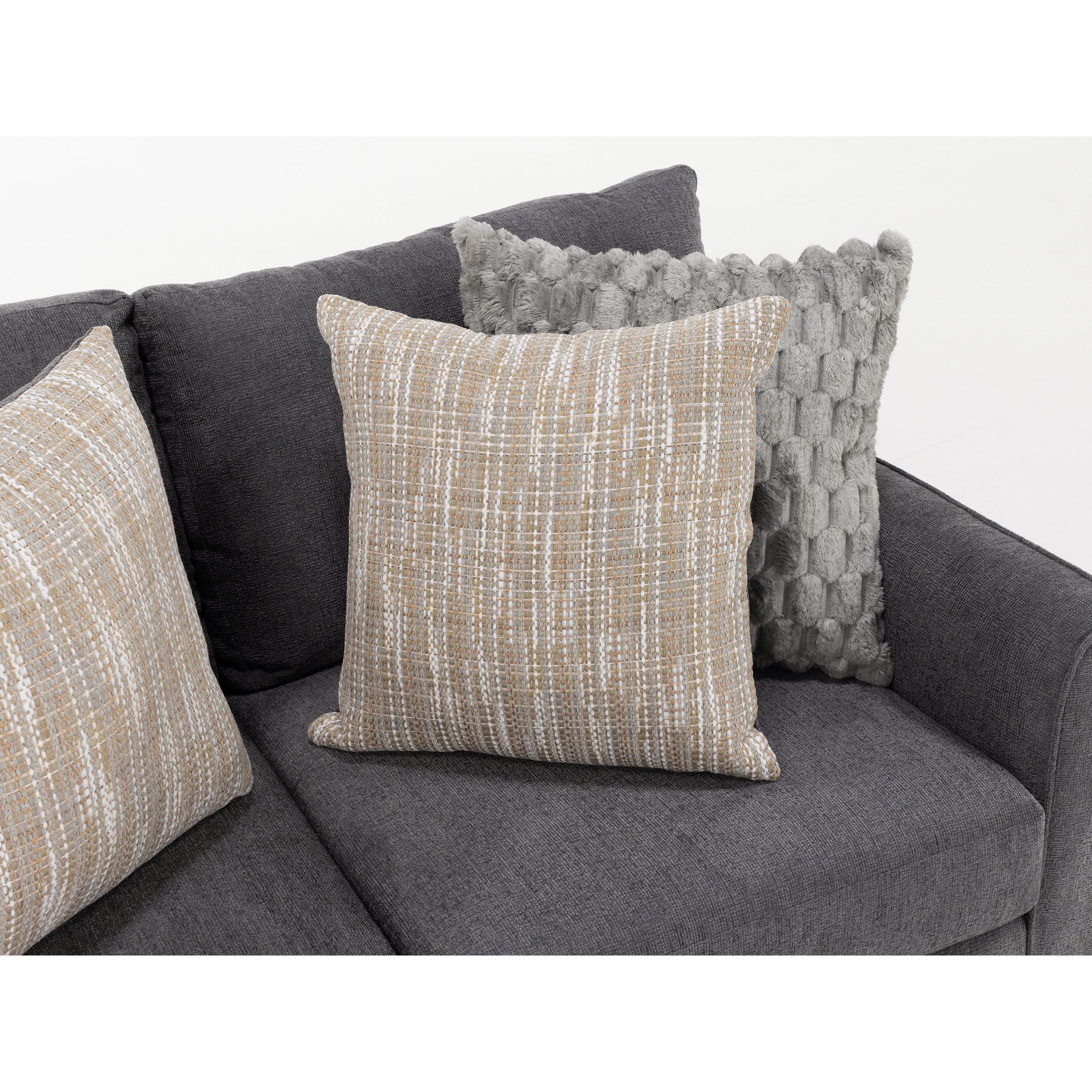 Two decorative throw pillows on a dark gray sofa.