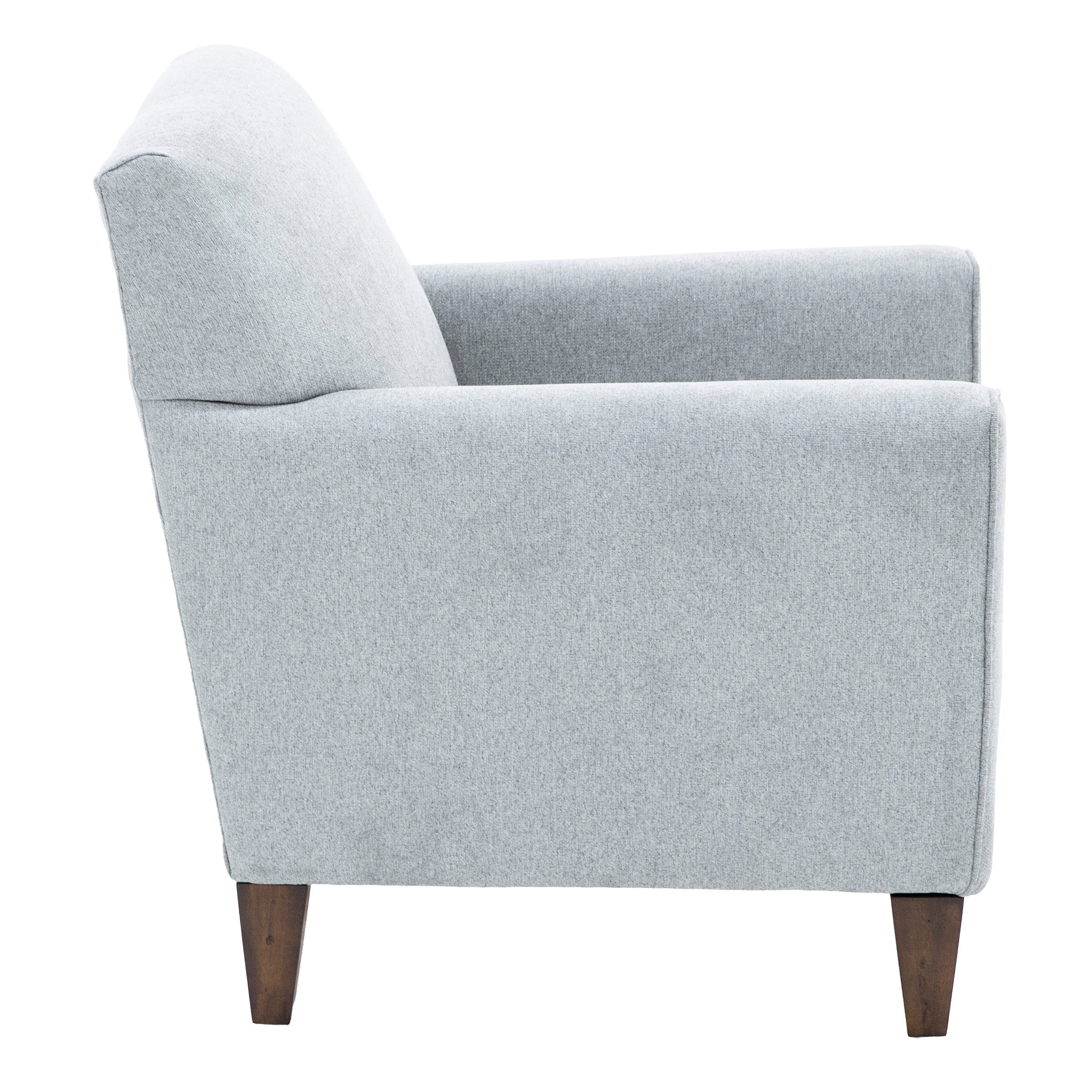 Side view of light gray upholstered armchair with wooden legs.