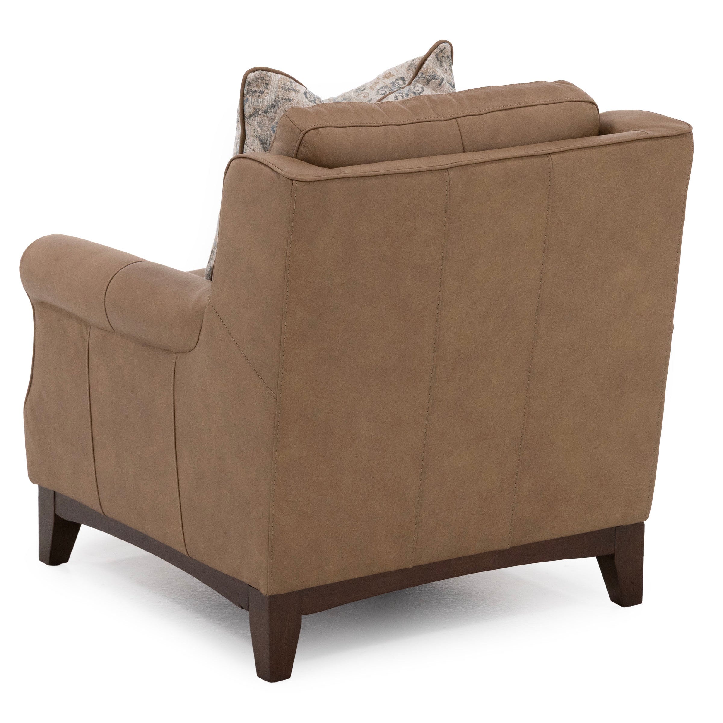 Back view of a brown armchair with wood legs and a decorative pillow.