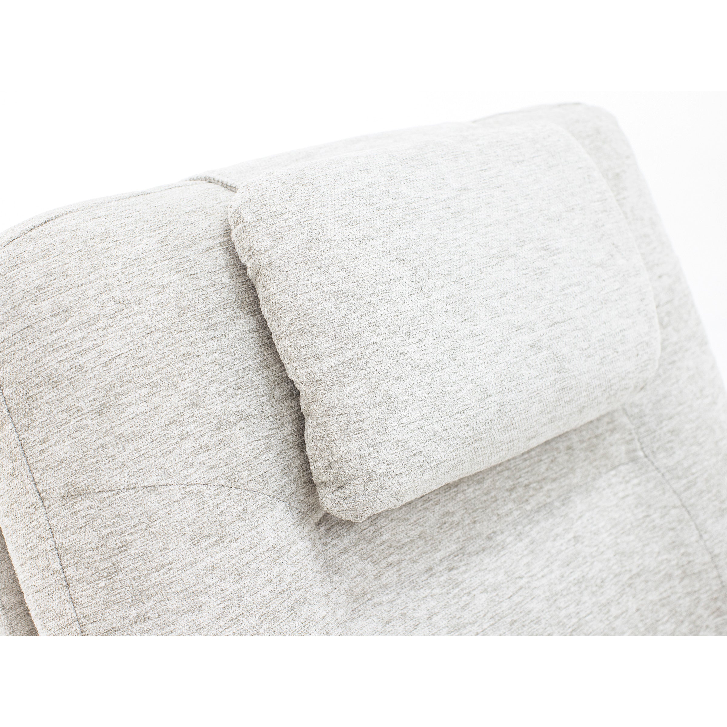 Close-up of a light gray upholstered chair headrest.