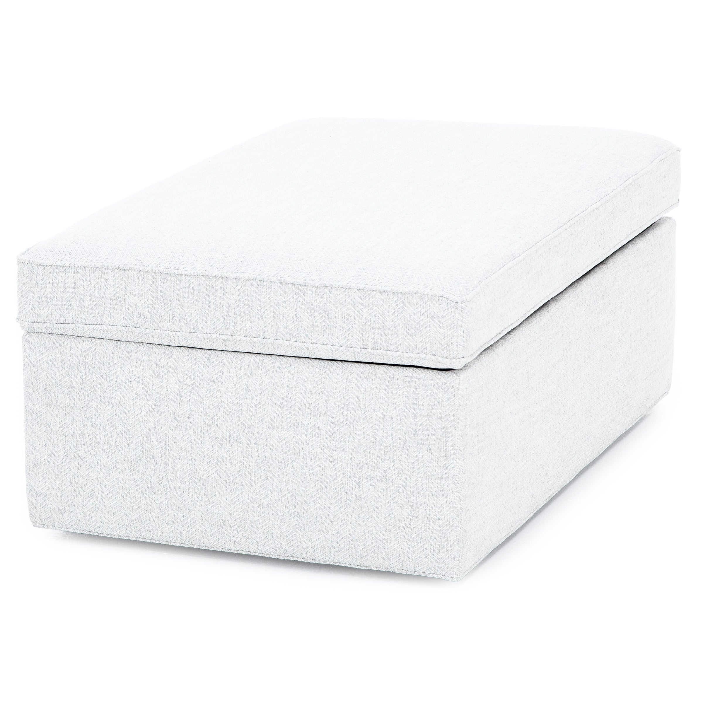 Light gray rectangular ottoman with a cushioned top.
