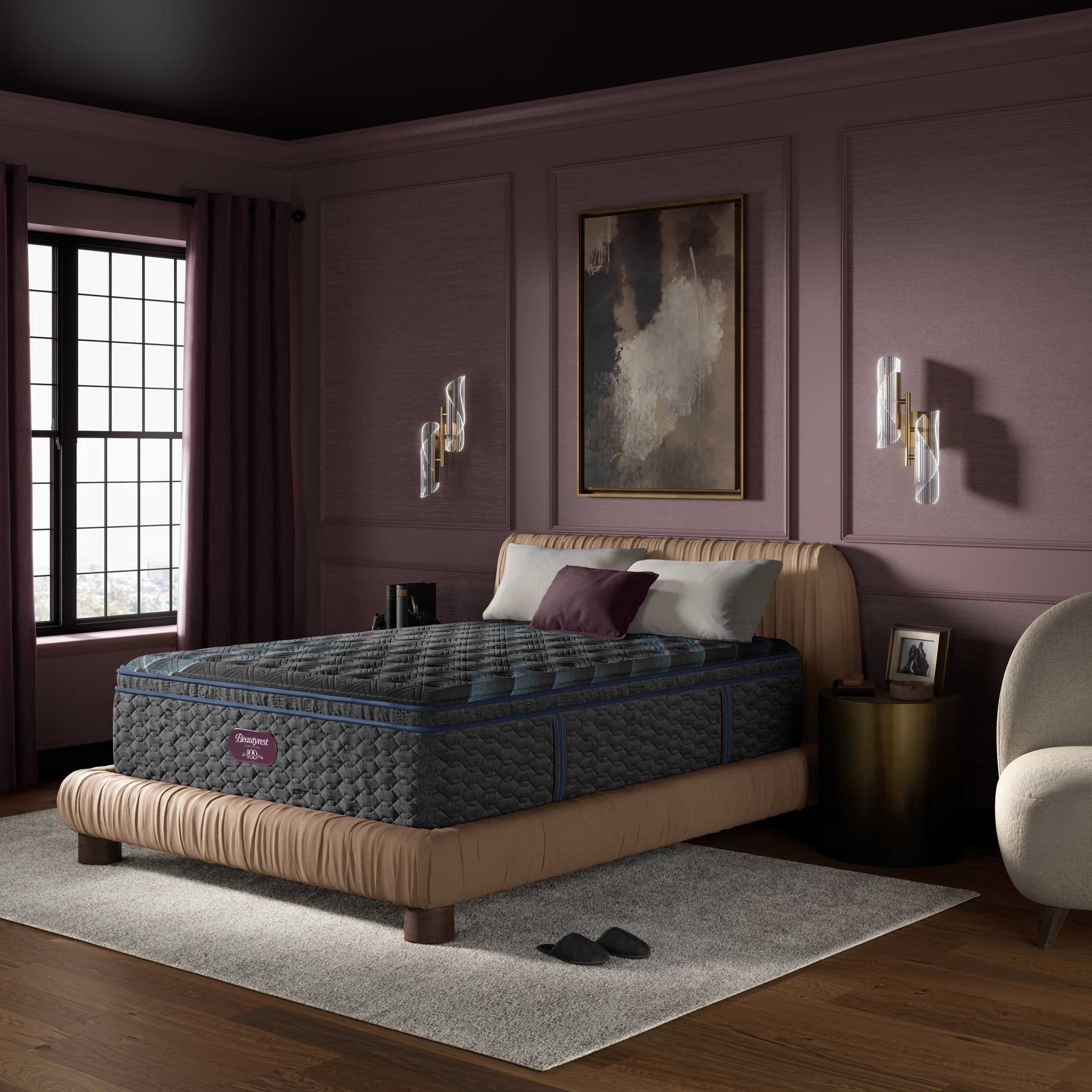 Modern bedroom with a plush mattress on a tan bed, soft lighting, and purple walls.