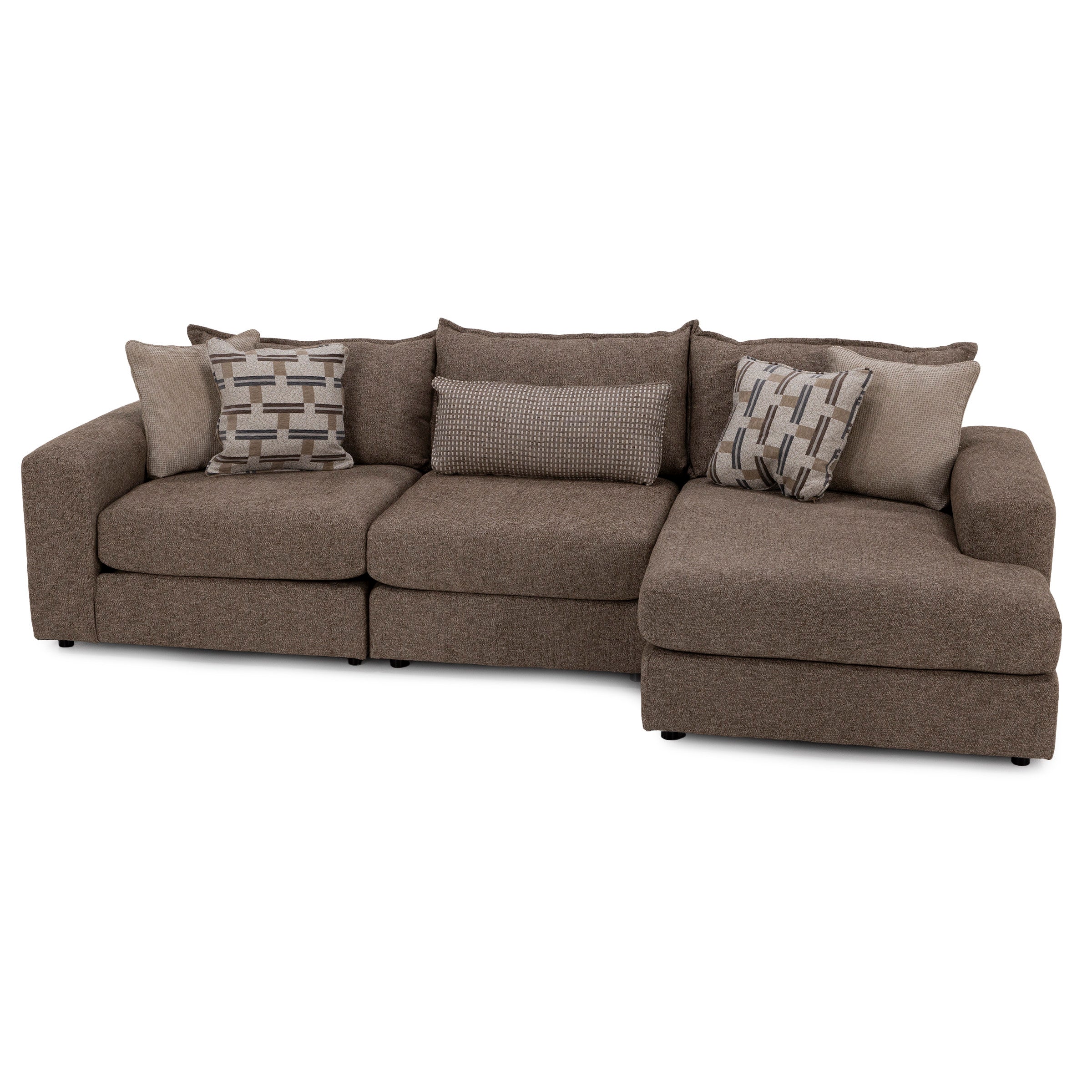 Brown sectional sofa with wide armrests, chaise lounge, and assorted patterned throw pillows.