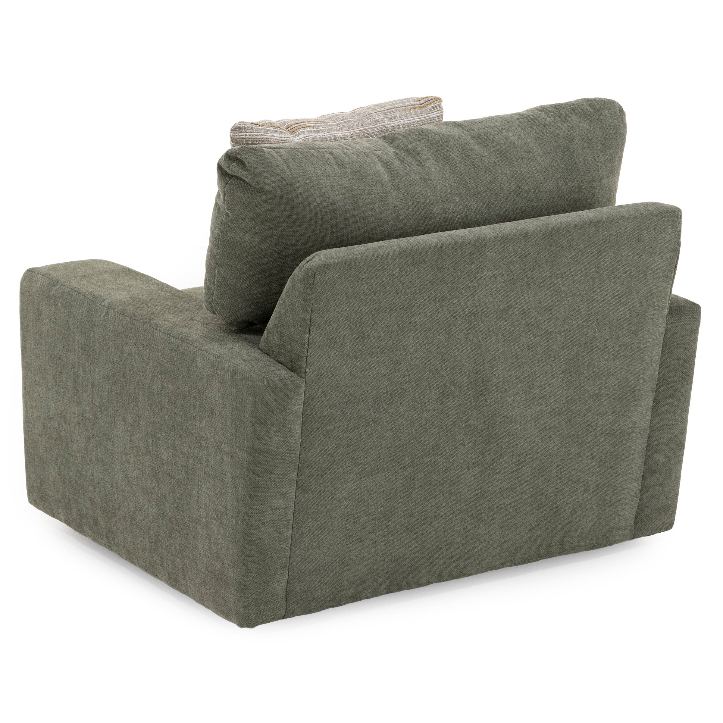Back view of a modern green armchair with wide cushions and a neutral accent pillow.