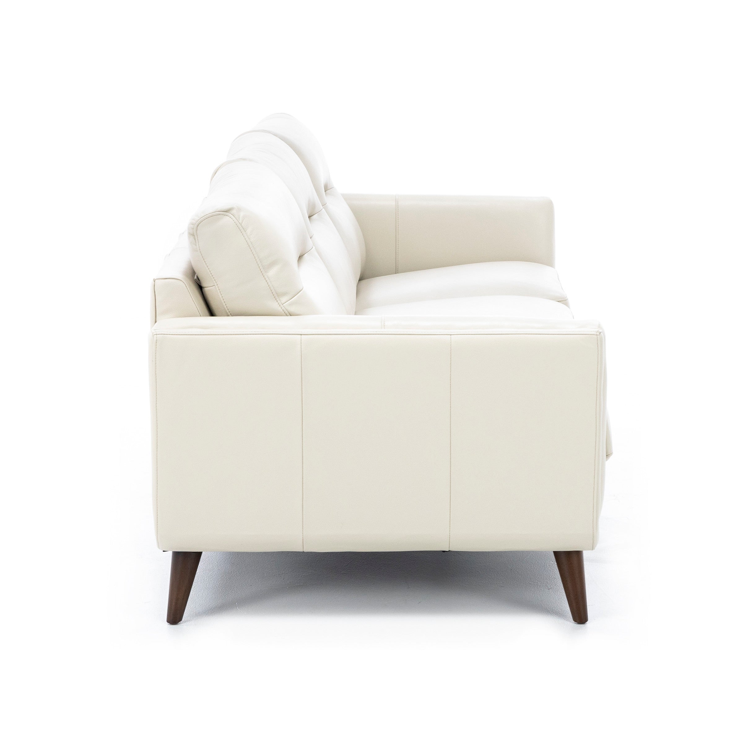 Side view of a modern cream-colored sofa with wooden legs.